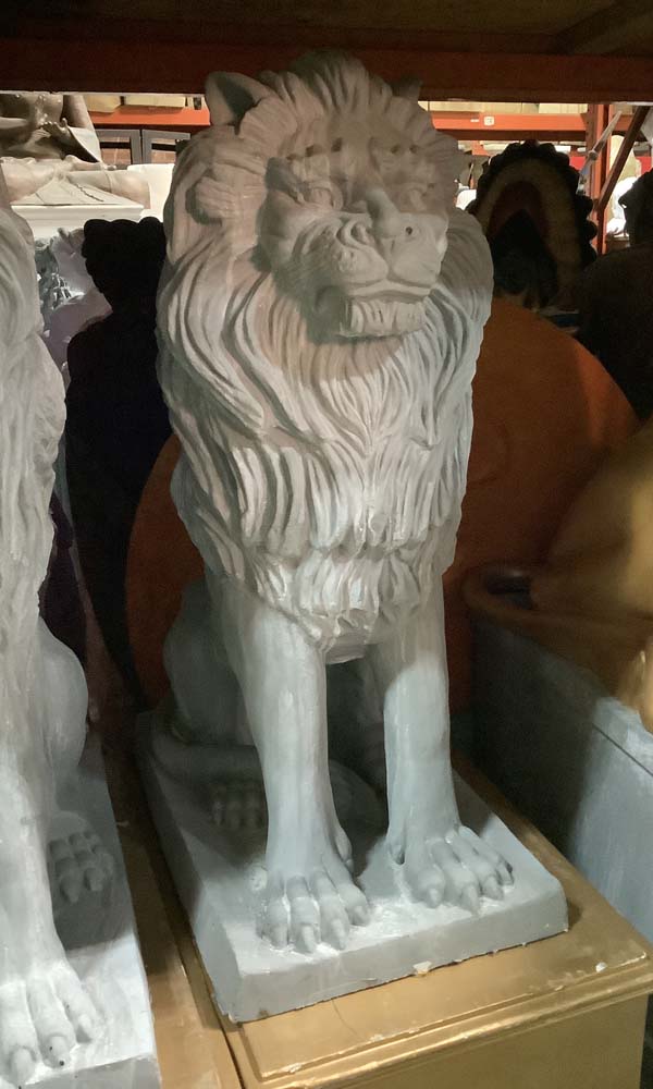 Lion on short pedestal