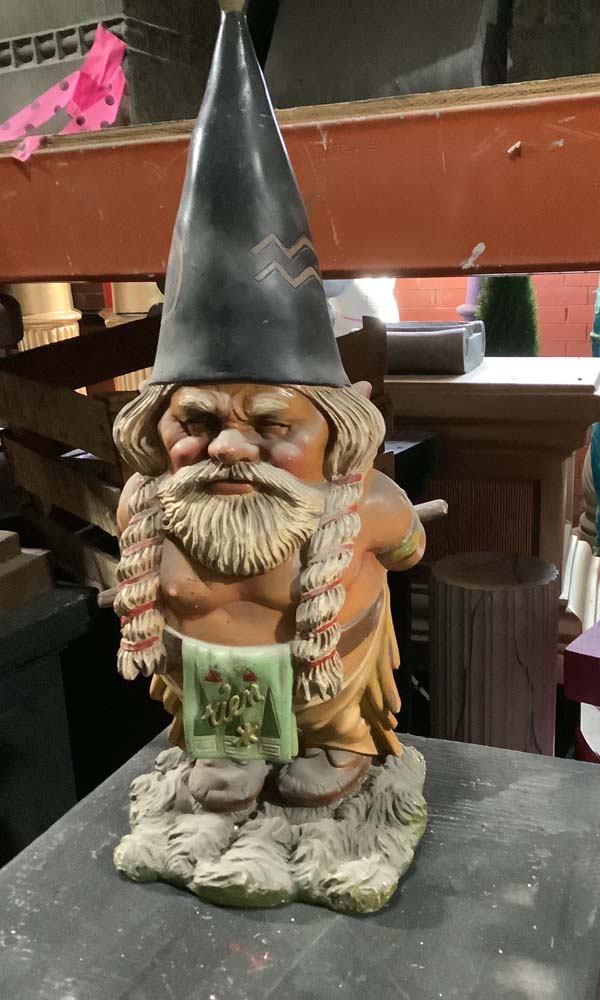 Indian chief gnome holding pipe behind him