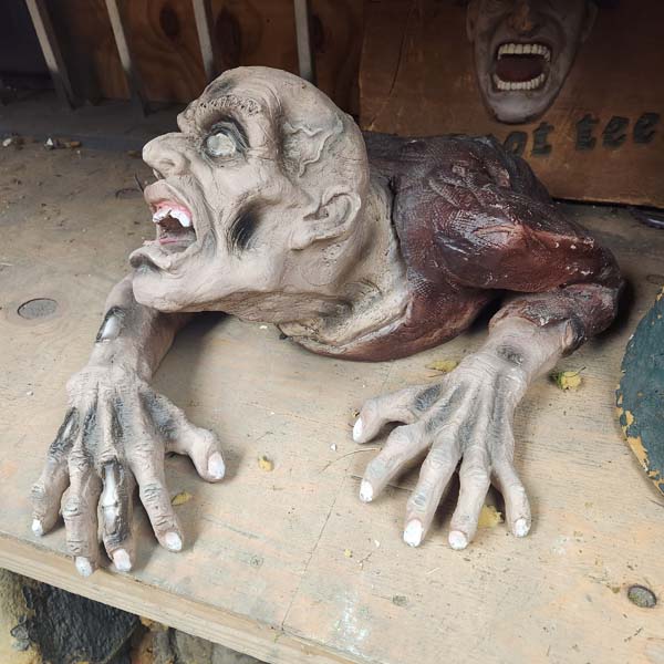 Dead body climbing out of grace-ceramic