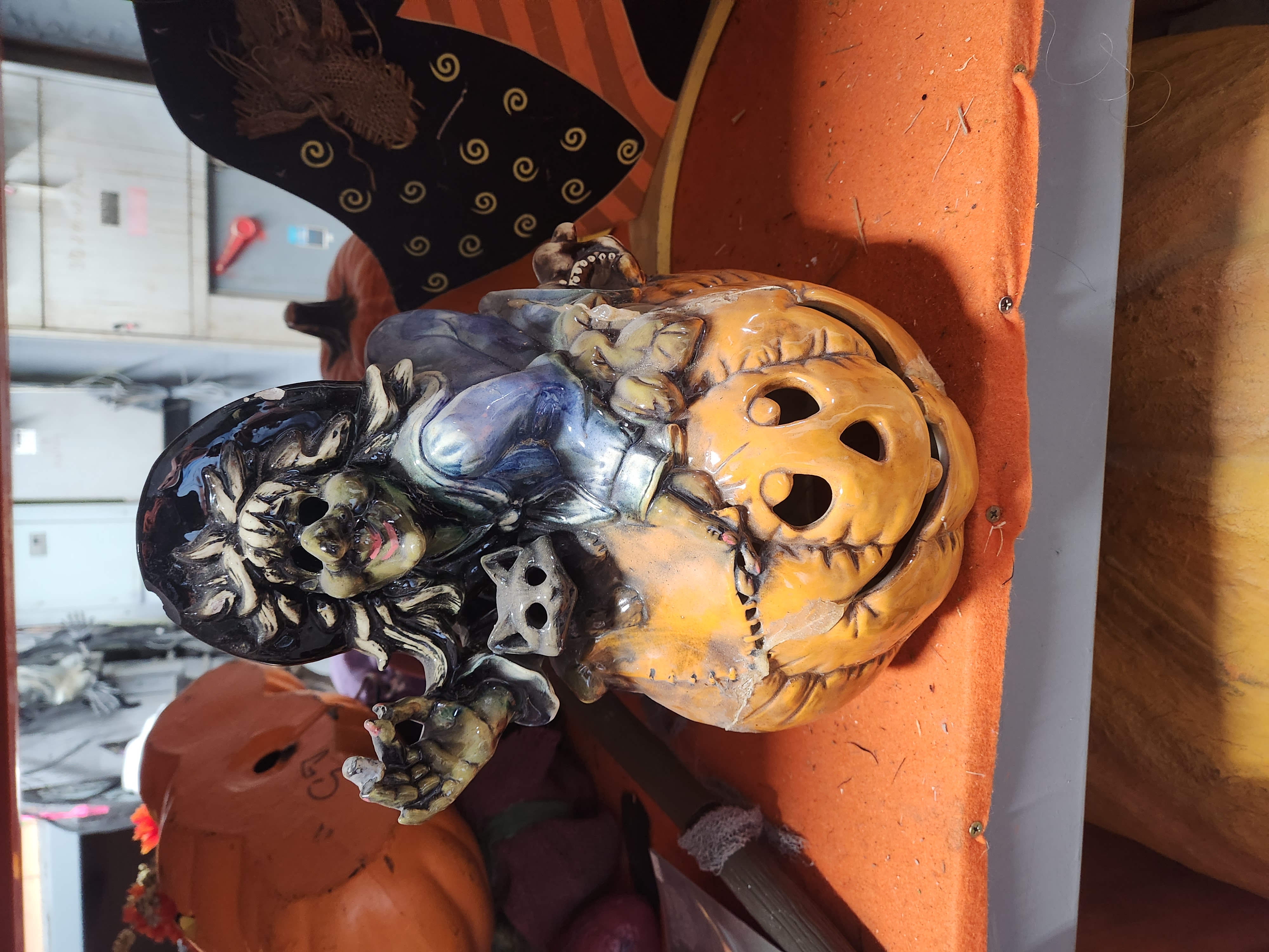 Ceramic witch and cat on pumpkin